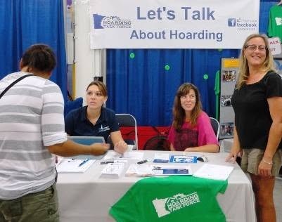 MNHTF volunteers at Let's Talk About Hoarding booth table