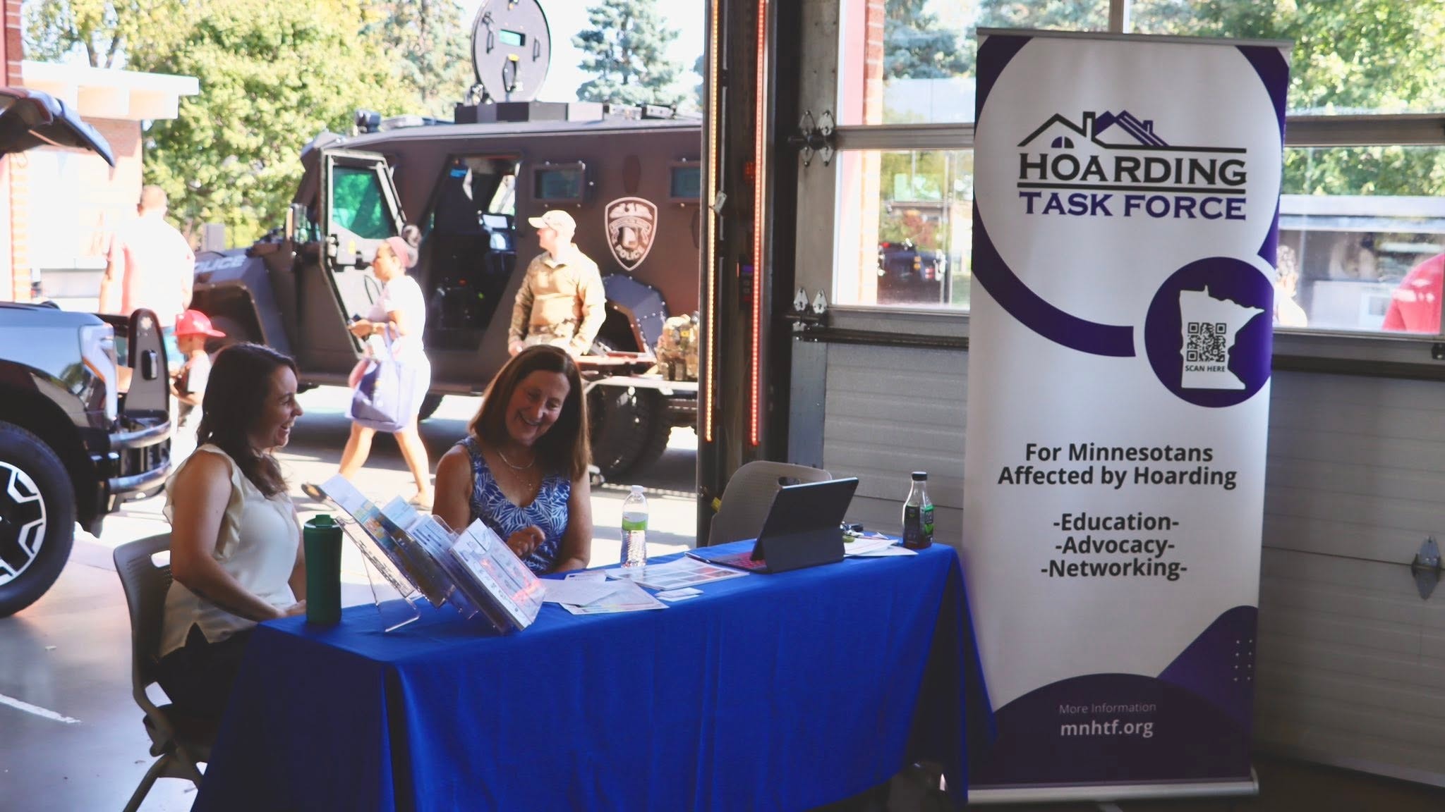 MNHTF volunteers at outreach booth during community safety day