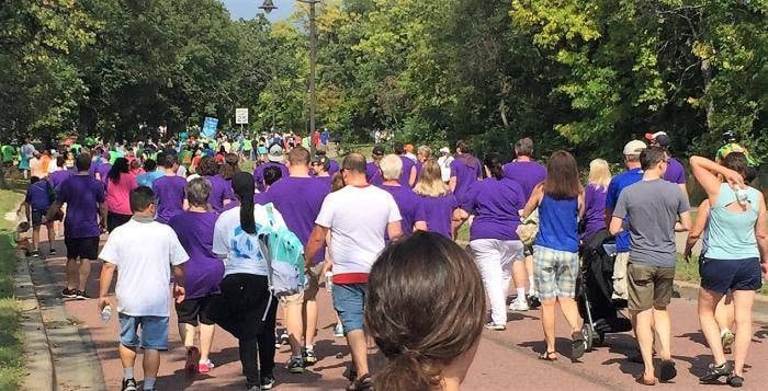 Large crowd in purple shirts at NAMI Walks